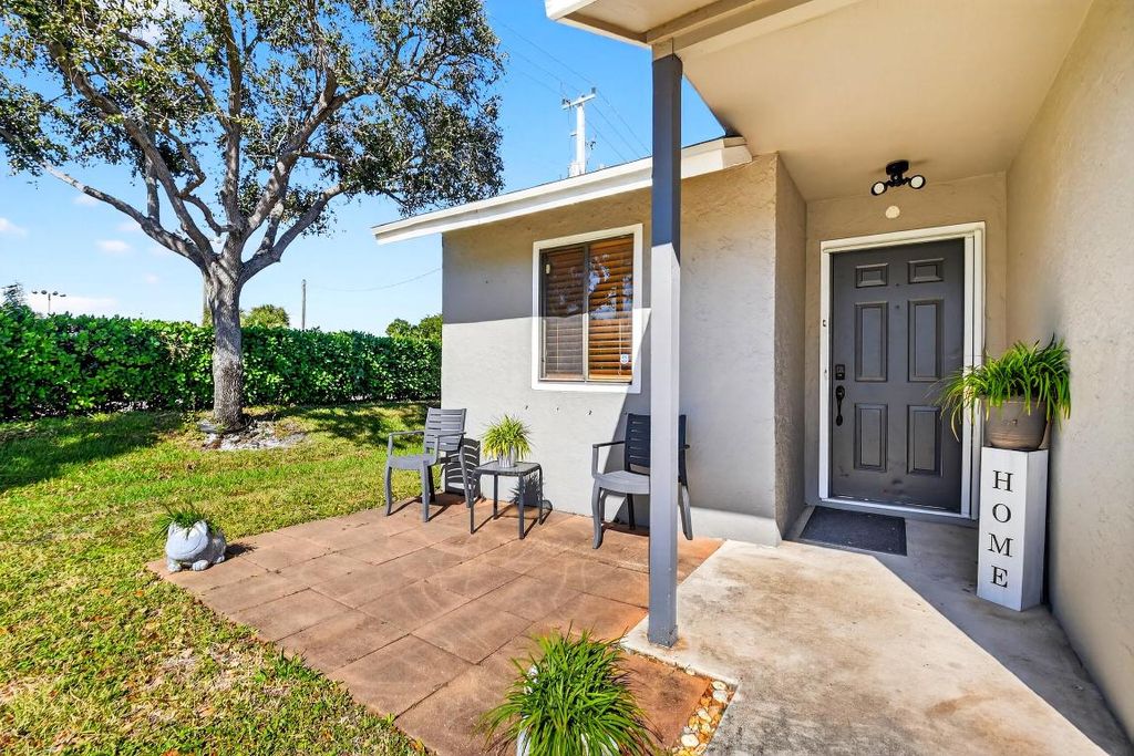 Photo of 6108 Channel Drive, Greenacres, FL 33463 (MLS # R11140883)