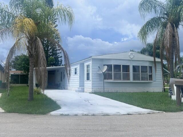 Beautiful Corner Lot Home in Spanish Lakes Riverfront! Welcome to this charming and fully furnished 2-bedroom, 2-bathroom home located on the desirable corner of Violeta and Los Lagos Ln in the scenic 55+ community of Spanish Lakes Riverfront.Offering 1,416 sq. ft. of living space, this spacious home features a comfortable Florida room perfect for morning coffee or evening relaxation. The large living room is ideal for entertaining and comes complete with an elegant electric fireplace that adds a cozy ambiance year-round. The home also boasts a long covered carport, providing ample parking and convenience. With plenty of natural light, tasteful furnishings, and a well-designed layout, this home checks all the boxes for easy Florida living.