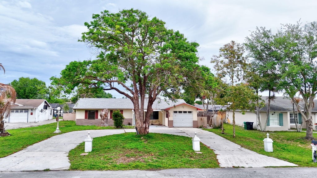 Photo of 325 NW Rebecca Avenue, Port Saint Lucie, FL 34983 (MLS # B26075101)