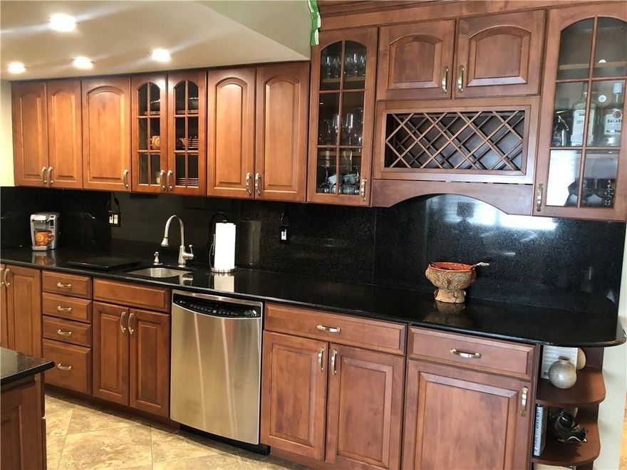 COMPLETELY REMODELED 1/1.5 CONDO CONVENIENTLY LOCATED ON THE GROUND FLOOR, WALK IN DISTANCE TO THE POOL & PARKING SPACE. REMODELED & EXPANDED KITCHEN + GRANITE COUNTER TOPS. UPGRADED BATHROOMS. FRESHLY PAINTED. NEWER WATER HEATER (1 YEAR). A MUST SEE! ASSOC REQUIRES 20% DOWN & 1 OCCUP 55+