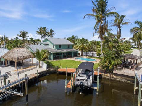 Photo of 1489 SW Seahawk Way, Palm City, FL 34990 (MLS # B26050536)