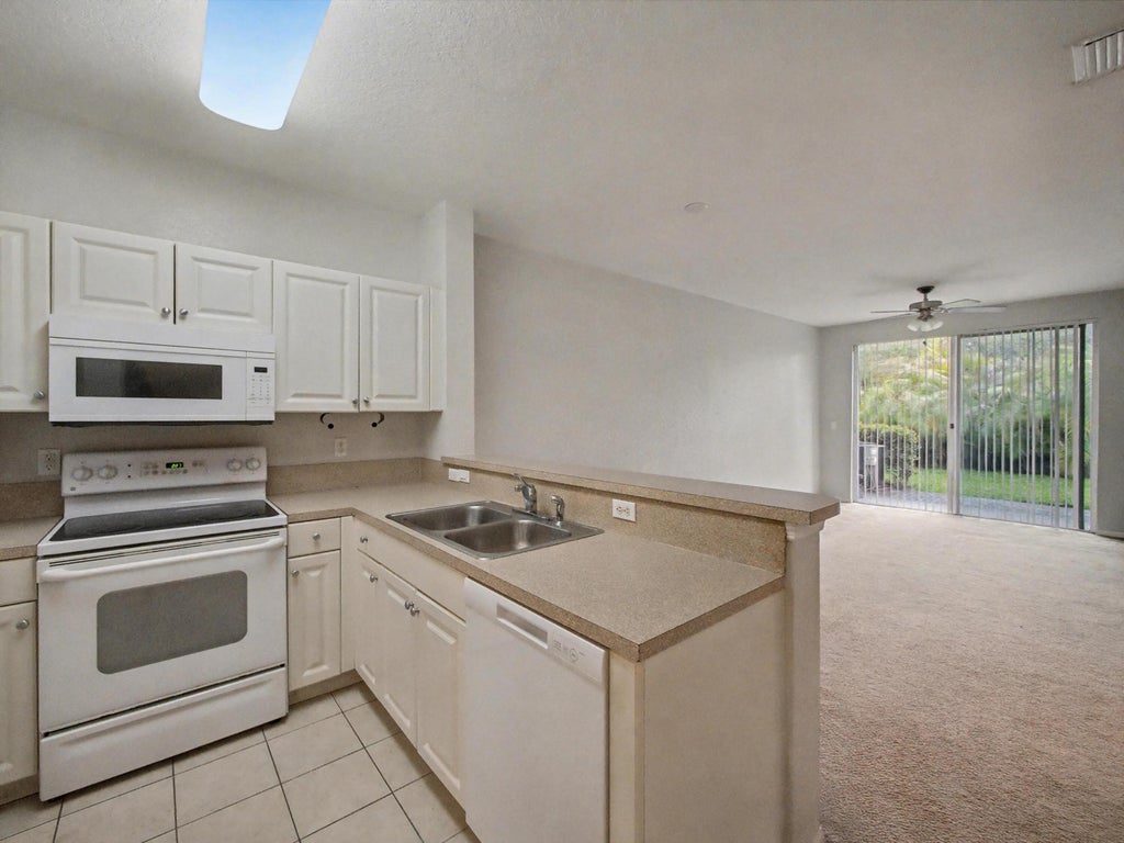 Photo of 3425 Sonoma Drive, Riviera Beach, FL 33404 (MLS # B26078760)