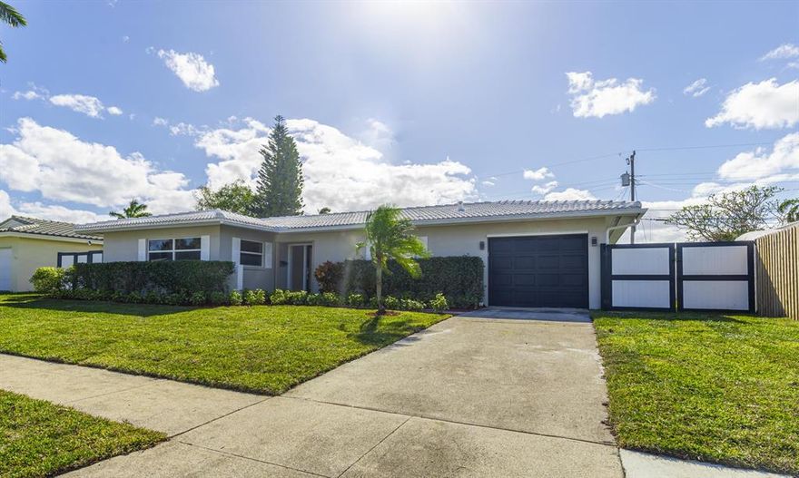 JUST RENOVATED!  CONTEMPORARY DESIGN!  ENTERTAINERS DREAM HOME.  OPEN BRIGHT FLOOR PLAN W SPLIT BEDROOMS.  KITCHEN BOASTS OVERSIZED QUARTZ ISLAND AND ALL NEW APPLIANCES.  BUILT IN WET BAR W A WINE COOLER.  GREAT ROOM OPENS TO POOL IN A FENCED YARD. MASTER BEDROOM HOSTS A FIREPLACE.  BEAUTIFUL WOOD LOOK FLOORING THROUGHOUT. NEW AC.  ''A'' RATED SCHOOLS  IMPACT WINDOWS. NO HOA.   MINUTES TO BEACHES AND DOWNTOWN BOCA.  (Steam shower does not work and will be removed)