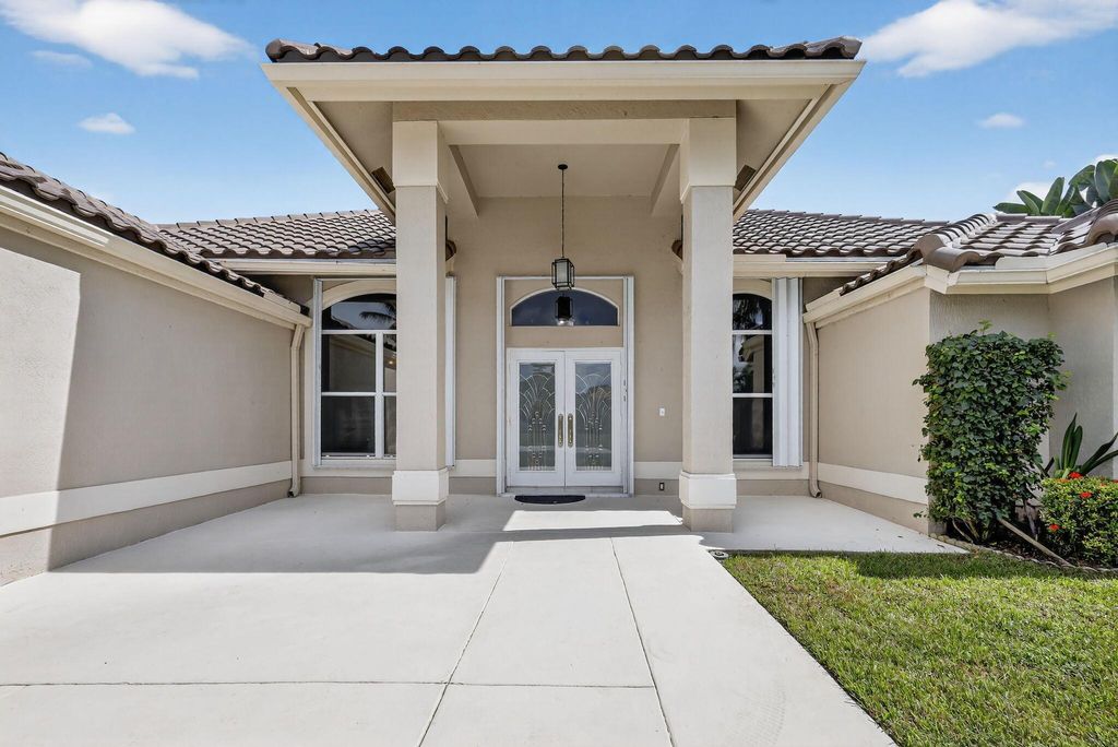 Photo of 5609 Lake Shore Village Circle, Lake Worth, FL 33463 (MLS # R11134971)