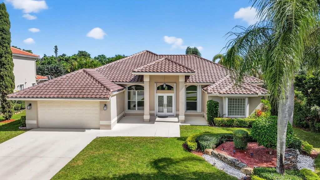 Photo of 5609 Lake Shore Village Circle, Lake Worth, FL 33463 (MLS # R11134971)