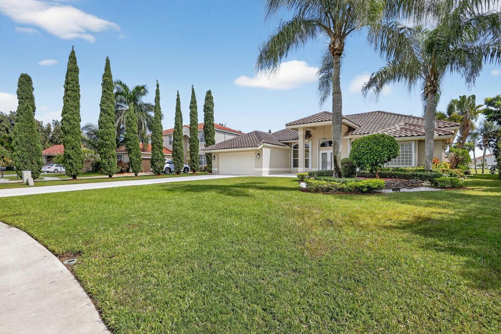 Photo of 5609 Lake Shore Village Circle, Lake Worth, FL 33463 (MLS # R11134971)