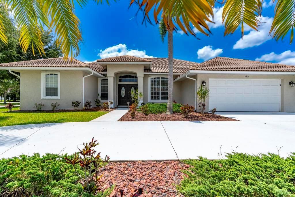 Photo of 2904 SW Sutton Place, Palm City, FL 34990 (MLS # R11089964)