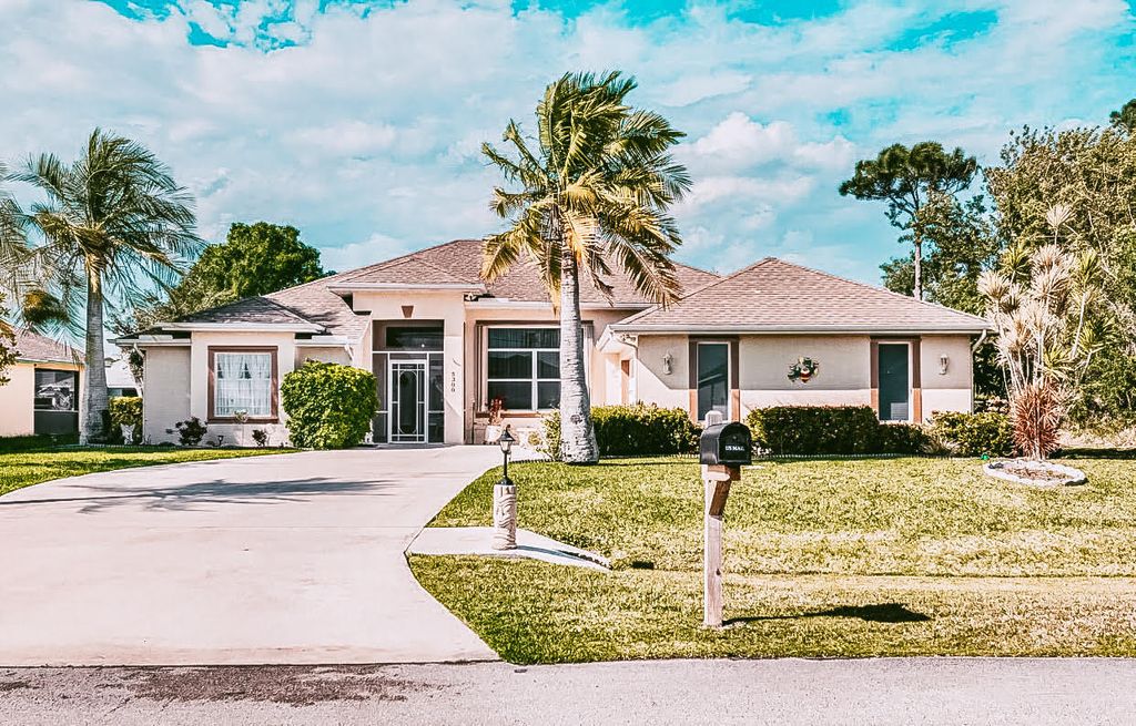 Photo of 5300 NW Almond Avenue, Port Saint Lucie, FL 34986 (MLS # R10752967)