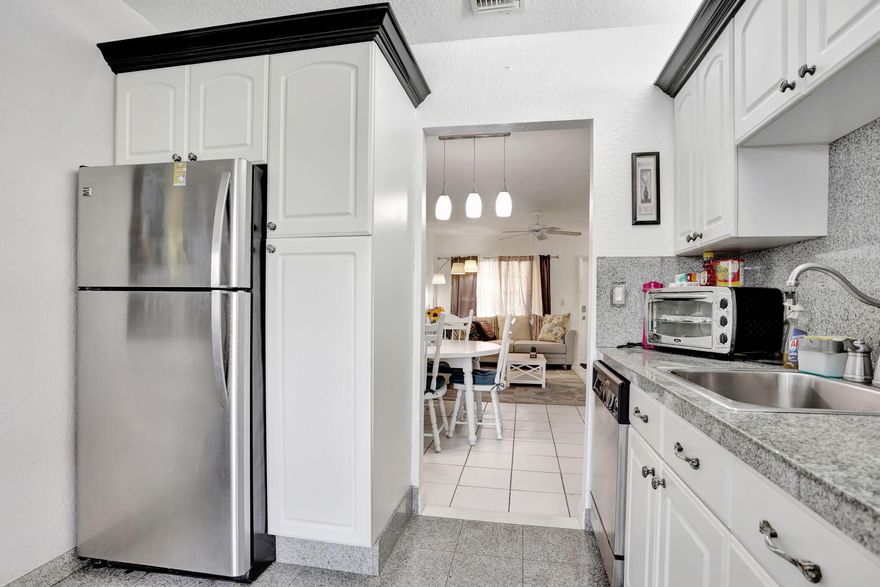 Beautifully maintained 1-bed, 1.5-bath unit in a desirable 55+ South Florida community. Features include a renovated kitchen, spacious primary bedroom, and a private enclosed balcony—perfect for relaxing or enjoying the peaceful setting. The additional half-bath offers added convenience for guests. Residents enjoy access to a wide range of amenities, including social events, recreational facilities, and lush landscaping. Furniture is available and may be negotiated separately. This move-in-ready home is an excellent opportunity to enjoy the comfort, charm, and active lifestyle of South Florida living.