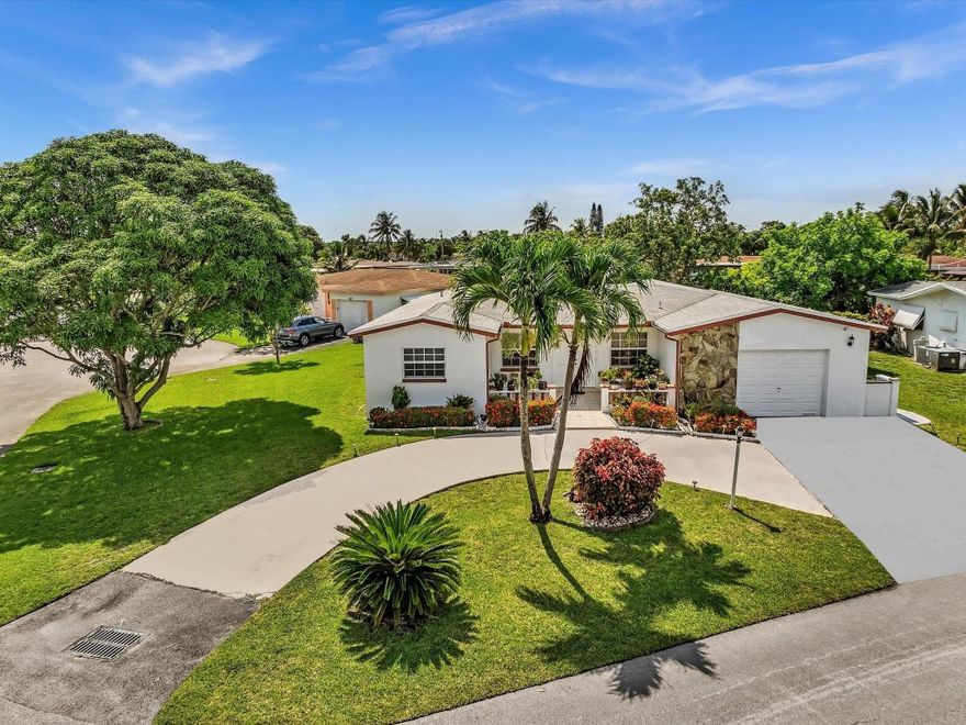 55+ COMMUNITY. ONLY 1 PERSON MUST BE 55 or older, other occupants must be 18 or older.  LOW TAXES & LOW MAINTENANCE FEE. ROOF 2018. HOA includes: lawn care, sprinkler system, & exterior painting. Step inside this well-maintained 3 bed/2 bath home & discover an open, airy floor plan designed for easy living and entertaining. Split floor plan offers privacy, formal dining & eat-in kitchen provides versatile spaces for meals & gatherings. Master suite features jacuzzi tub/shower & walk-in closet. Other upgrades: impact windows & doors. Oversized lot w/ circular driveway, this home boasts stunning, unobstructed water views w/mature fruit trees. A peaceful cul-de-sac location offers privacy & tranquility.