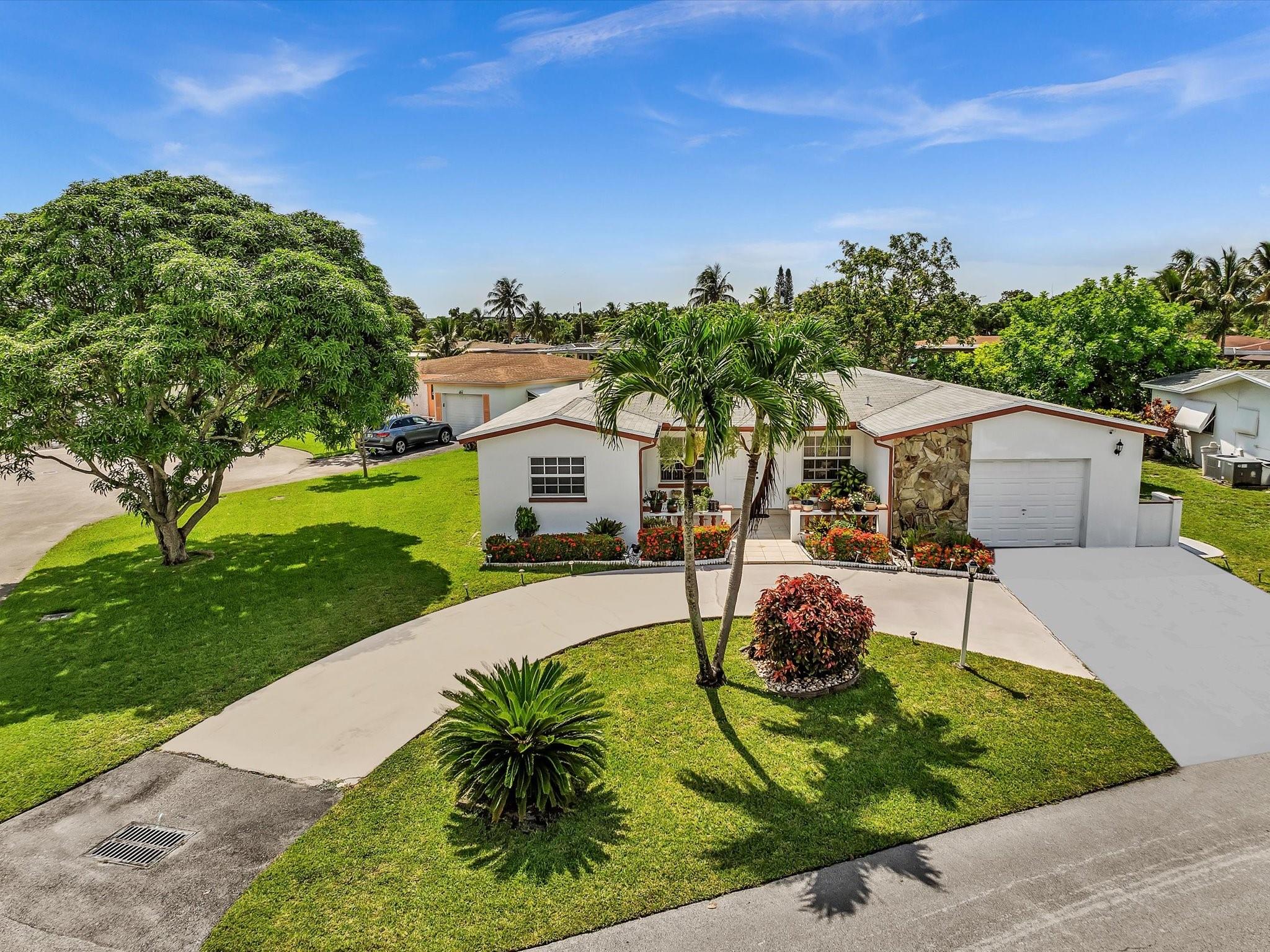 This inviting home offers a serene & carefree lifestyle, perfect for those 55 & older. ONLY 1 PERSON MUST BE 55 or older, other occupants must be 18 or older. LOW TAXES & LOW MAINTENANCE FEE. ROOF 2018. HOA includes: lawn care, sprinkler system, & exterior painting. Step inside this well-maintained 3 bed/2 bath home & discover an open, airy floor plan designed for easy living and entertaining. Split floor plan offers privacy, formal dining & eat-in kitchen provides versatile spaces for meals & gatherings. Master suite features jacuzzi tub/shower & walk-in closet. Other upgrades: impact windows & doors. Oversized lot w/ circular driveway, this home boasts stunning, unobstructed water views w/mature fruit trees. A peaceful cul-de-sac location offers privacy & tranquility.
