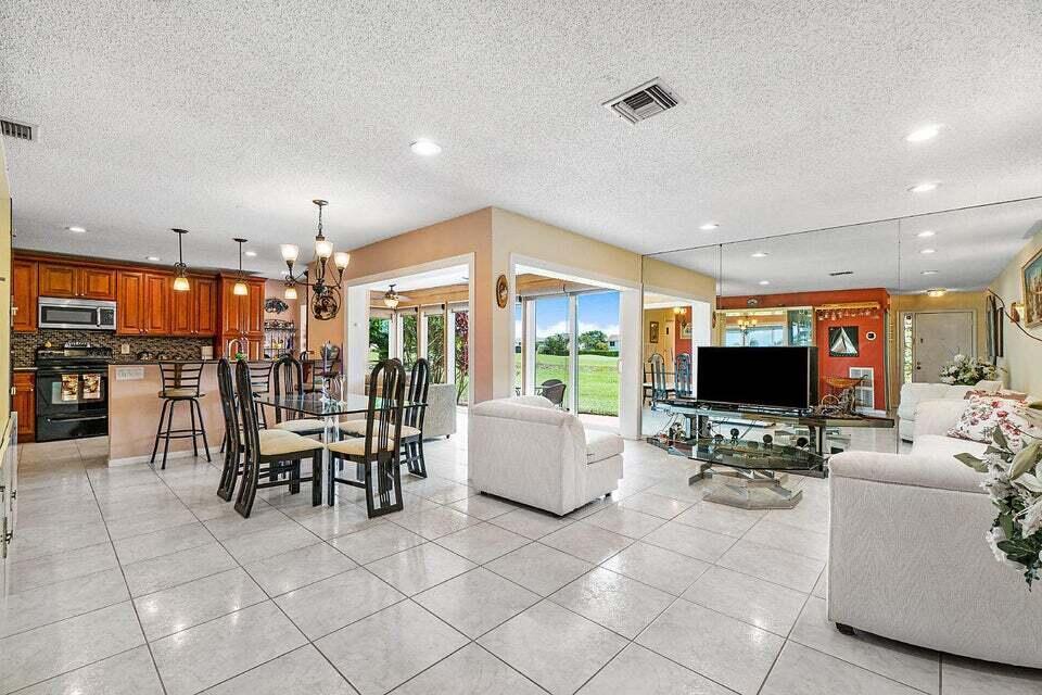 COME ENJOY THE SUNNY SOUTHERN FLORIDA WEATHER IN THIS LOVELY UPDATED 2 BEDROOM/ 2 BATH VILLA WITH GORGEOUS GOLF VIEWS FROM THE BREAKFAST NOOK, DINING ROOM, LIVING ROOM OR AIR CONDITIONED FLORIDA ROOM OR SIT ON THE OUTSIDE PATIO TO CATCH THE SUN OR GRILL OUT WITH FRIENDS. REMODELED KITCHEN FEATURES GRANITE COUNTERTOPS, STAINLESS STEEL APPLIANCES & LOVELY WOOD CABINETS. SPACIOUS MASTER BEDROOM HAS A KINGSIZE BED & A HUGE WALK IN CLOSET! GUEST BEDROOM FEATURES A COMFORTABLE QUEEN SIZED MURPY BED OR WHEN NOT IS USE, MAKES A GREAT OFFICE WITH A DESK! GUEST BATHROOM IS BEAUTIFULLY REMODELED WITH FRAMELESS SHOWER WITH A BENCH SEAT. RELAX AT THE POOL RIGHT ACROSS THE STREET. INDIAN SPRING IS A MANNED GATED COMMUNITY CLOSE TO RESTAURANTS, SHOPPING & 10 MINUTES TO THE BEACH!!