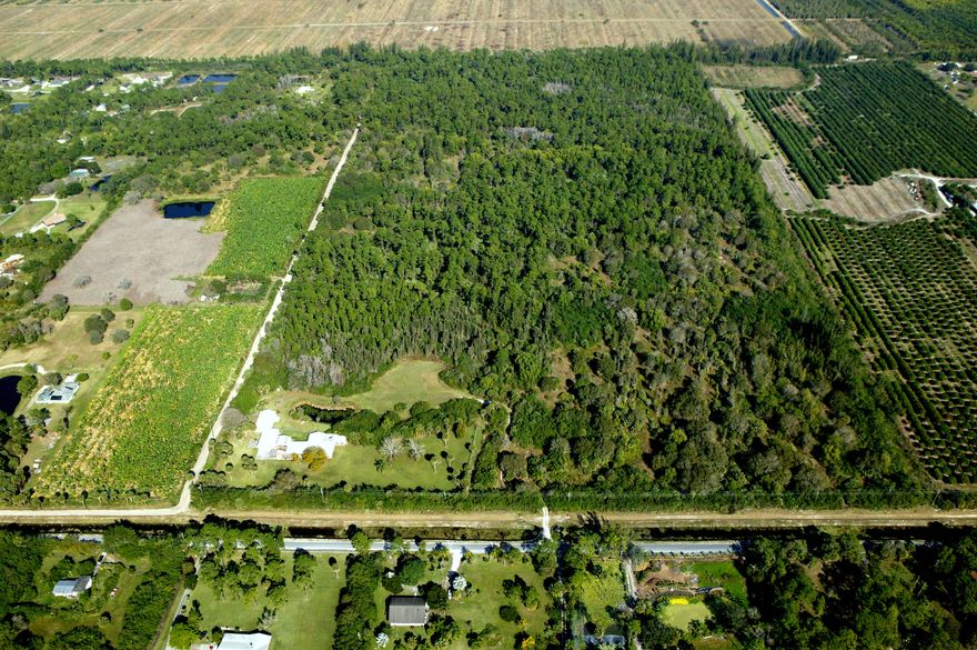 Fantastic business opportunity to develop or subdivide this 80 acre parcel. A quick 8 miles to the Winter Equestrian Festival, Global Dressage, and the International Polo Club. House situated on 5 improved acres with a pond. 75 remaining acres are unimproved and can be easily subdivided by buyer. Acreage total is 80 Acres. Land divided into 6 separate parcel control numbers.