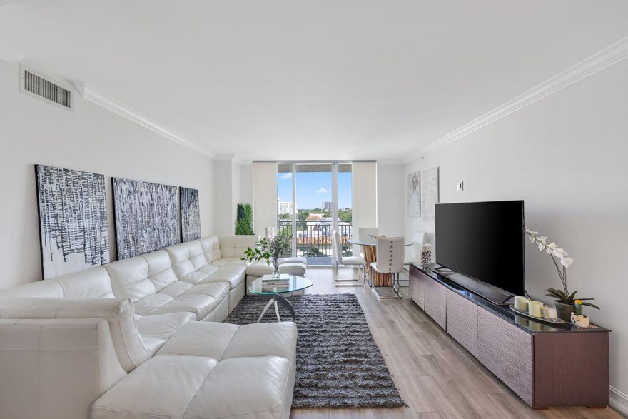 Welcome to Unit 609 at Palmetto Place, a beautifully maintained 2-bedroom, 2-bath residence in the heart of Downtown Boca Raton. This light-filled condo offers a spacious and inviting layout, ideal for both year-round living and seasonal enjoyment. An east-facing balcony captures serene golf course views and stunning sunrise skies, offering the perfect place to begin the day or unwind in the evening with a gentle coastal breeze. The white kitchen is finished with quartz countertops and modern details, blending style and functionality for both casual living and entertaining. Thoughtfully designed, the residence offers a comfortable floor plan with generously sized bedrooms, ample storage, and an airy living space that feels both open and welcoming. Palmetto Place is known for its exceptional resort-style amenities, including a heated pool, fitness center, sauna, basketball court, elegant lobby, valet, 24-hour front desk, and secure building access. Residents also enjoy the convenience of restaurants located on the ground floor. Just moments from Mizner Park, Royal Palm Plaza, fine dining, boutique shopping, entertainment, and Boca Raton's pristine beaches, Unit 609 delivers an exceptional downtown lifestyle in one of the city's most desirable locations.