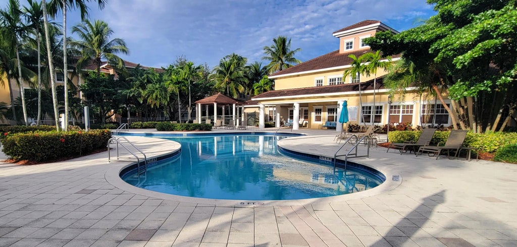 Photo of 6418 EMERALD DUNES Drive #201, West Palm Beach, FL 33411 (MLS # B26079627)