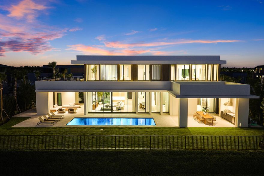 BRAND NEW, JUST COMPLETED--this 5-bedroom, 6.5-bath estate by highly acclaimed architect Max Strang sits on a 1/2-acre lot in the most desirable location within Panther National, Palm Beach County's newest and most exclusive golf community. Enjoy the best views overlooking the lake, manicured greens, and spectacular sunsets. Spanning 11,023 total SF, the home offers 10'6'' ceilings, floor-to-ceiling glass, a 312-bottle wine cellar, and 2nd level loft area and wet bar. Full Smart Home automation includes Lutron lighting, solar panels, motorized screens, and automated shades. Outdoor living features multiple terraces, a summer kitchen, pool, and spa with golf and lake views. The chef's kitchen includes Wolf & Sub-Zero appliances, dual ovens, a spacious walk-in pantry, and catering kitchen. T