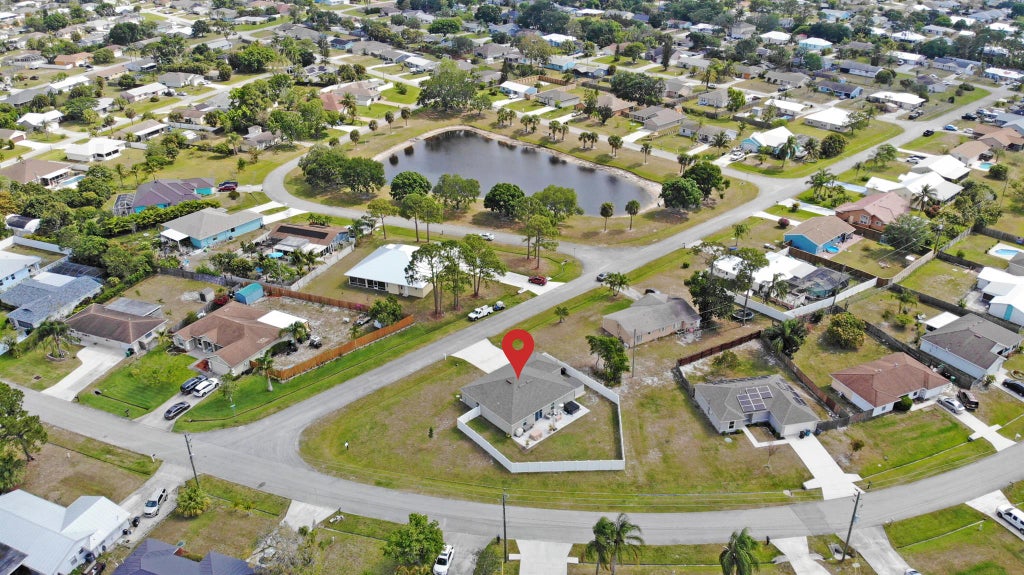 Photo of 402 SE Doat Street, Port Saint Lucie, FL 34983 (MLS # R11082392)