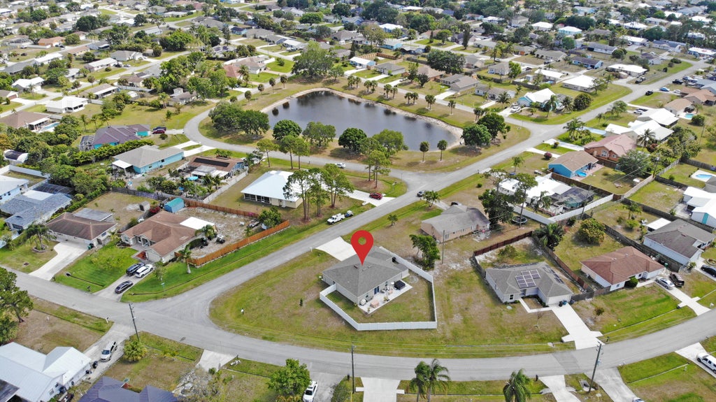 Photo of 402 SE Doat Street, Port Saint Lucie, FL 34983 (MLS # R11082392)