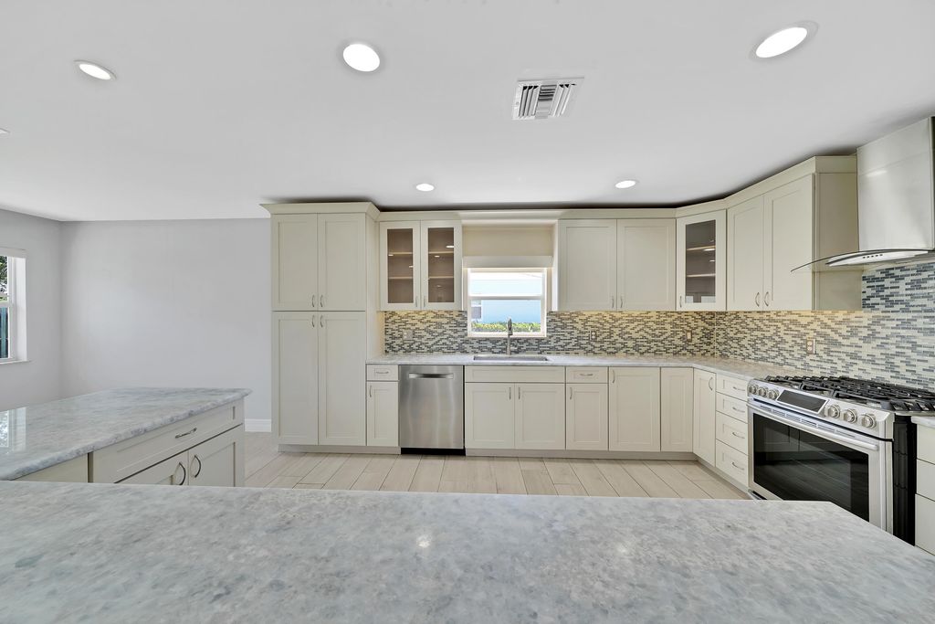 Photo of 2388 E EDGEWATER Drive, Palm Beach Gardens, FL 33410 (MLS # B26056840)