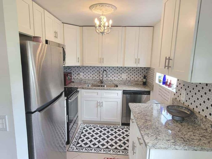 "Motivated Seller" ... Immaculate Turnkey First-Floor Corner Unit – Fully Remodeled and Furnished. Bright and airy 2BD/2BA, move-in ready to enjoy the Florida lifestyle. Features laminate flooring throughout, modern kitchen with granite countertops, stainless steel newer 2022 appliances, and cabinets. Recent upgrades include a new A/C with Nest thermostat, water heater, and new electrical panel. short walk to the Clubhouse and the on-site restaurant and pools. Relax on landscaped back patio with beautiful view. Experience resort-style living with endless social activities or simply relax under the Florida sunshine. 10 minutes to the Beach ... perfect for those who love both relaxation and active living. Will not last!