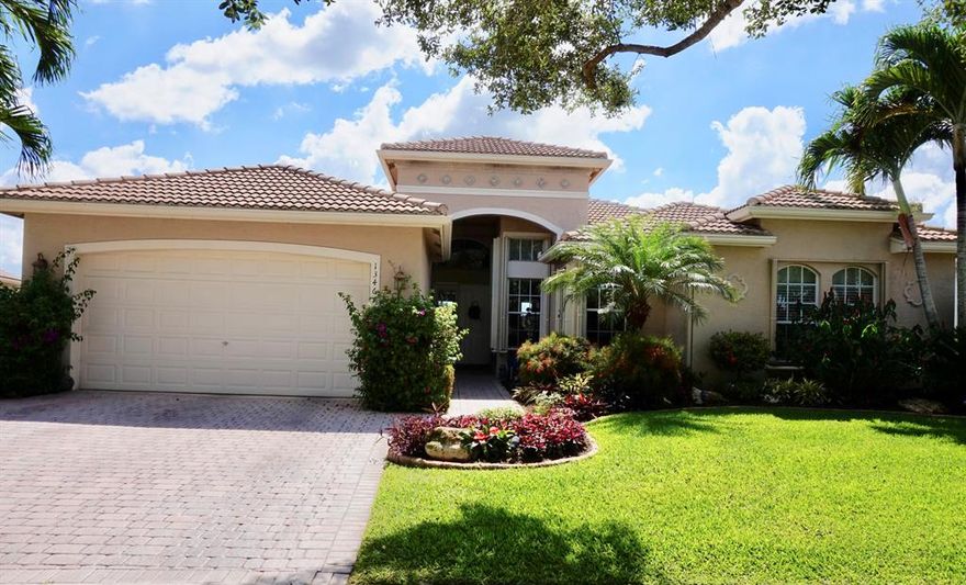 Immaculate Avila model with gorgeous landscaping. Spectacular lot and views with eastern facing yard on grande lake.  Jerusalem stone floors in main living areas. Relax in heated pool and spa with views of grande lake and clubhouse. Crown molding throughout and beaded corners. Gorgeous kitchen with white cabinets, glass doors, stainless steel appliances and granite counters. Beautiful architectural details.  French doors from family room and living room to patio/pool area. Master bedroom with trey ceiling, dual fitted closets and spectacular views of lake. Amazing home! Won't last! All measurements deemed accurate and should be independently verified.  Buyer pays a 1X capital contribution of $1725.00 at closing.