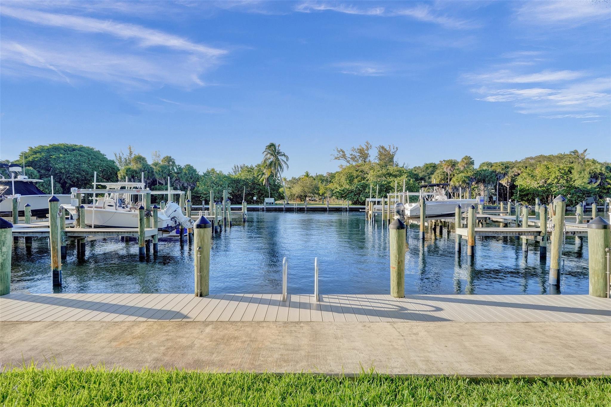 Waterfront living at its finest! Bring your boat—your private dock is just steps from the kitchen and included with no extra charge. This spacious and beautifully maintained 3-bedroom, 2.5-bath home offers stunning water views from the open-concept living, dining, and kitchen areas. Upstairs, you'll find all three bedrooms, a versatile loft/bonus room, and a dedicated laundry room. Gorgeous real hardwood floors flow throughout the home, adding warmth and character. Enjoy a private backyard, a two-car garage, and the ultimate South Florida lifestyle. The dock accommodates up to a 30-foot boat and comes equipped with water, electric, and whips—perfect for boaters. Available for annual lease!