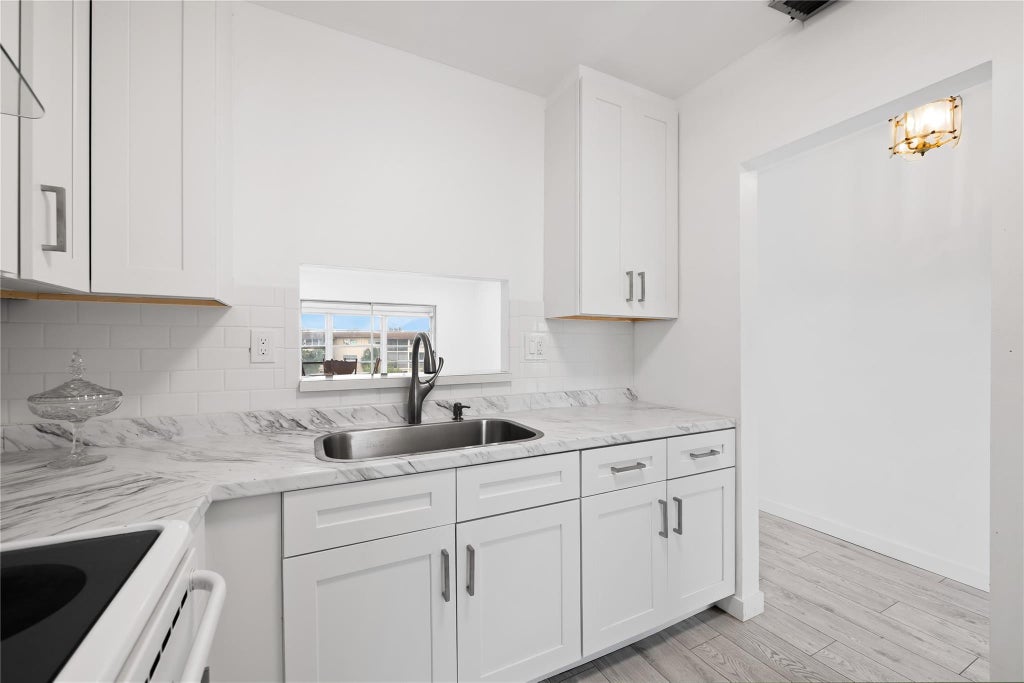 Photo of 5031 W Oakland Park Boulevard #309, Lauderdale Lakes, FL 33313 (MLS # B26039627)