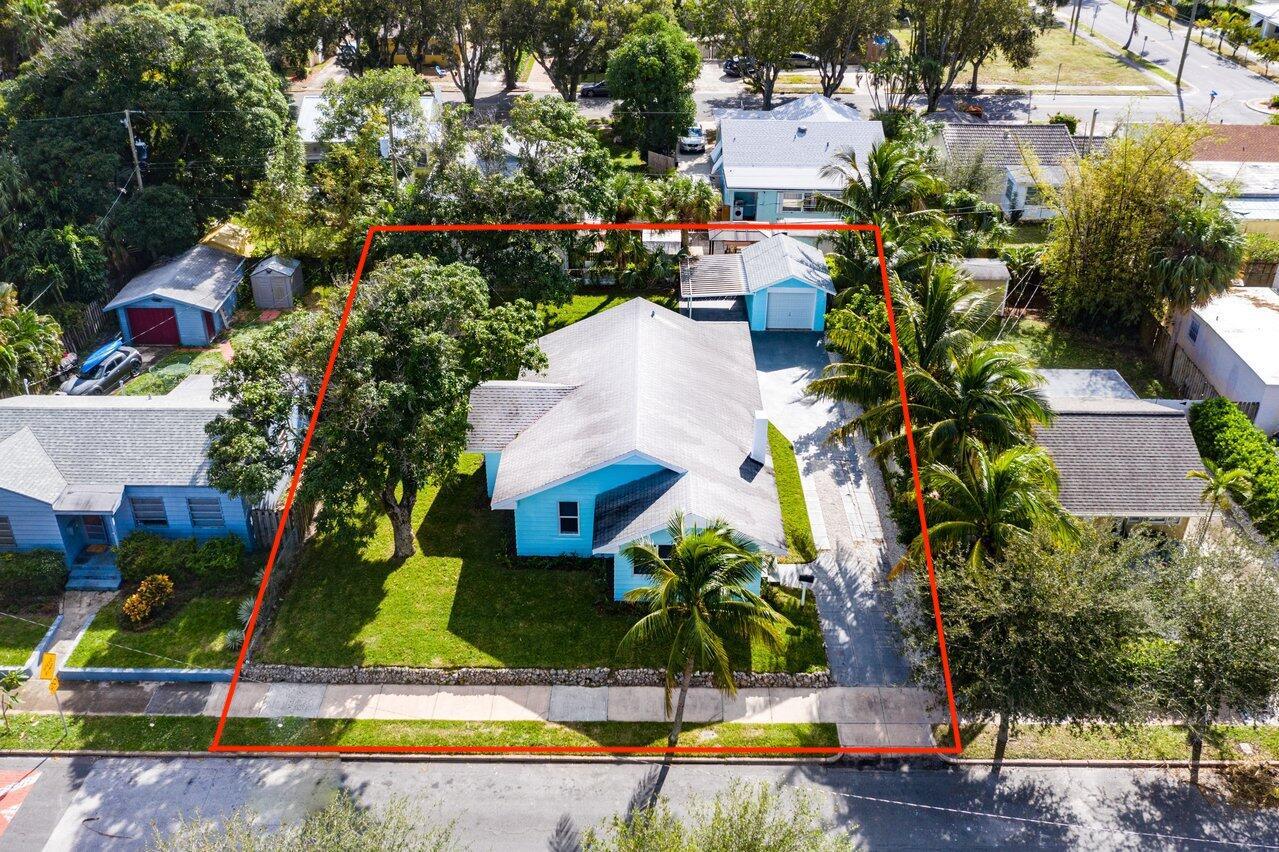 Northwood! Charming three bedroom home with a detached garage. Amazing location! Only steps to the Intracoastal Waterway. This home sits on a huge lot offering a large yard. Step inside and be greeted by the open spacious living areas and bedrooms. Ample closet space, central a/c, and laundry room. Tons of room to help meet your all of your parking/storage needs with a long driveway, carport, & detached garage. Bring your cars, trucks, boats etc. Pet friendly. Located only a short distance to Downtown West Palm Beach, The Square/ City Place, Clematis, Rybovich Marina, Norton Museum, Marina Village, the new NORA District, Brightline, amazing shopping/dining, I-95, PB airport, Palm Beach Island, The Breakers, Worth Ave, Royal Poinciana Plaza, & Beaches. Lawn maintenance is included. No HOA.