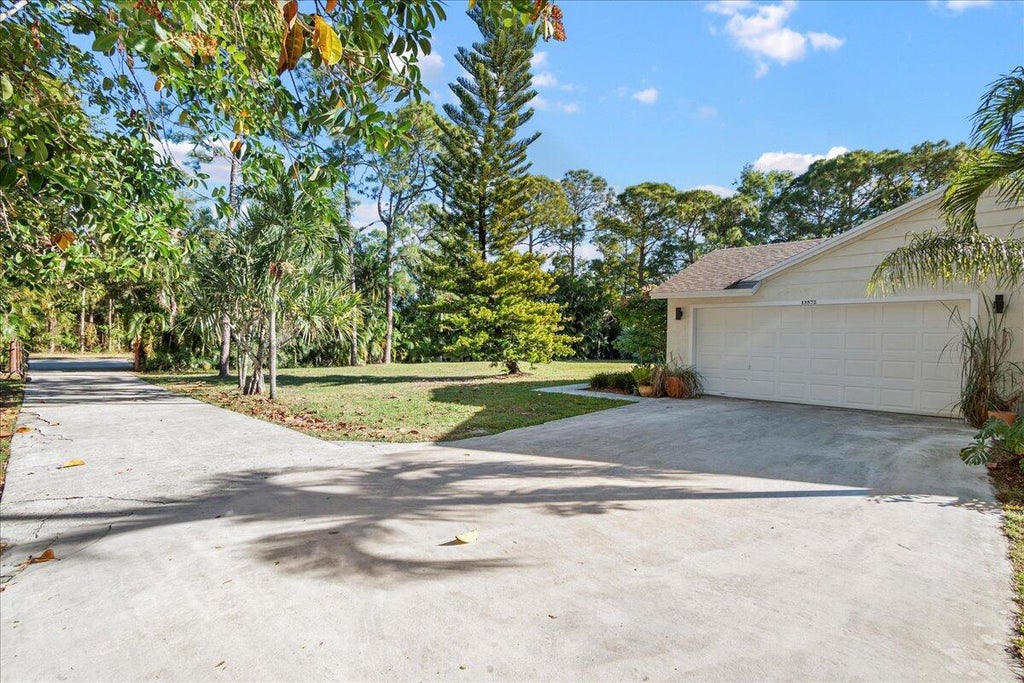 Photo of 13572 54th Lane N, West Palm Beach, FL 33411 (MLS # R11042014)