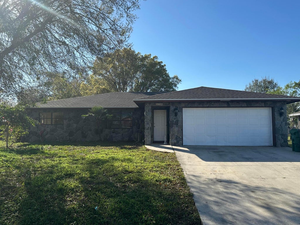 Photo of 1562 SW Avens Street, Port Saint Lucie, FL 34986 (MLS # R11063525)