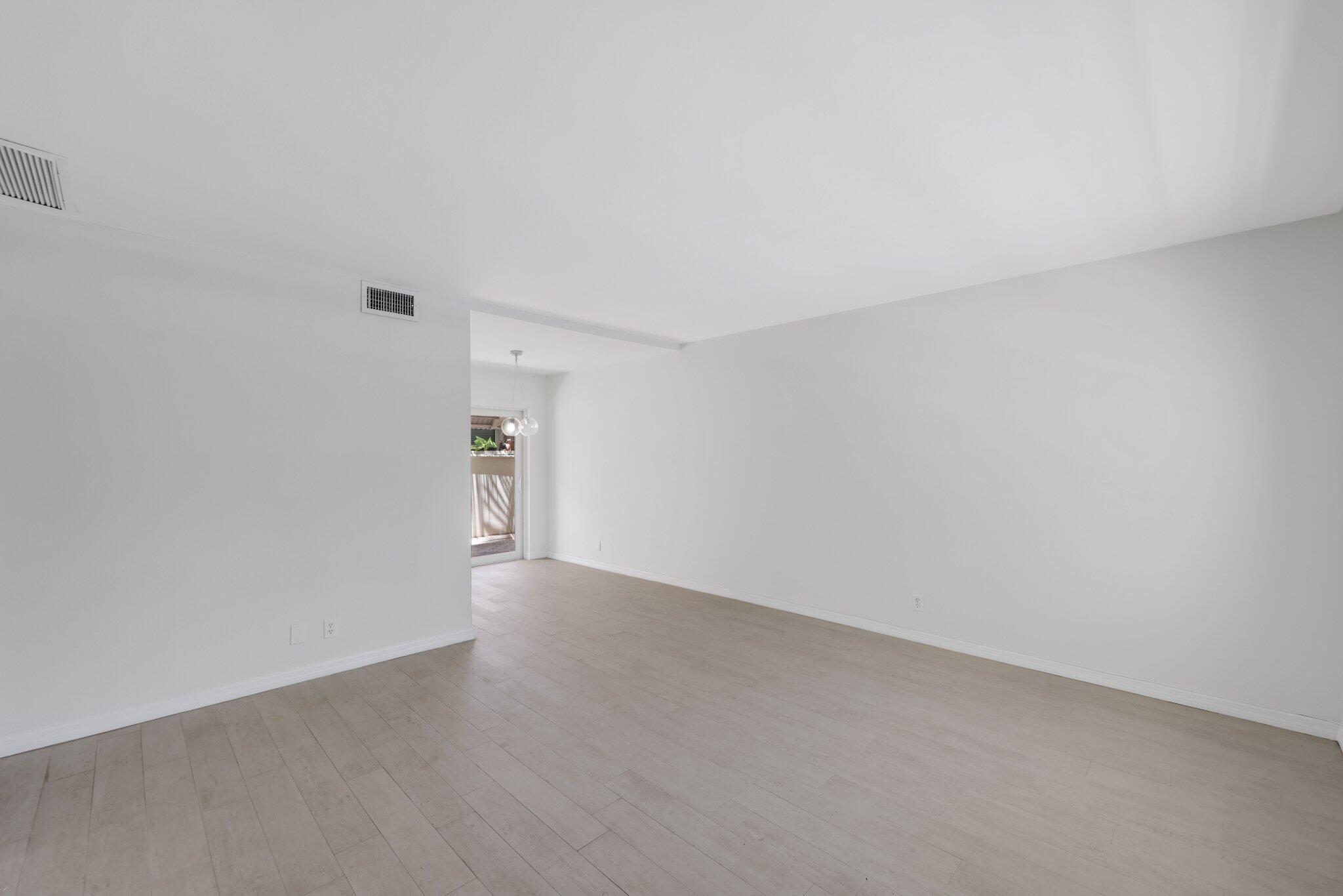 Step into this spacious and bright ground-floor condo, perfectly situated in the highly sought-after Victoria Park area. This home features a generous living space with sleek flooring and crisp white walls that create a modern, inviting atmosphere. The kitchen is a standout, boasting waterfall quartz countertops, a stylish subway tile backsplash, and stainless steel appliances--perfect for any home chef.Enjoy views of the sparkling pool from your front window, along with the peace of mind that comes with hurricane-impact windows and doors. Just through the sliding glass doors, you'll find a private outdoor seating area--ideal for relaxing or entertaining.The updated bathroom and walk-in closet add comfort and convenience off the primary bedroom.Make this beautiful condo yours today!