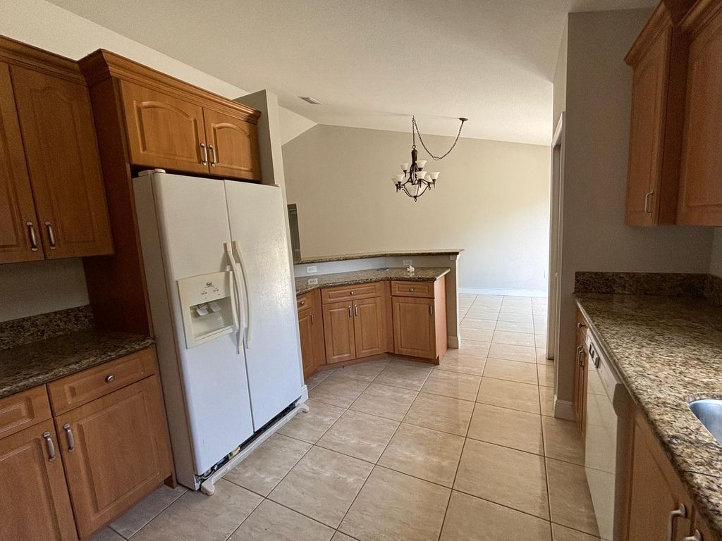 Photo of 1341 SW Oriole Lane, Port Saint Lucie, FL 34953 (MLS # B26031645)