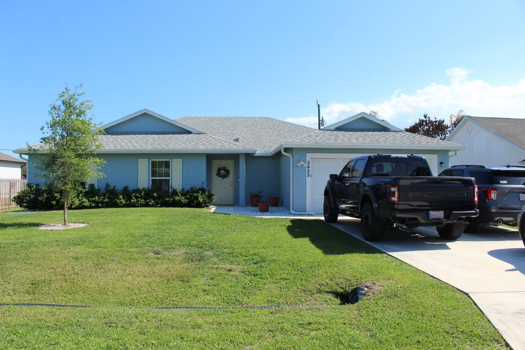 Photo of 5425 NW Edgewater Avenue, Port Saint Lucie, FL 34983 (MLS # B26020459)