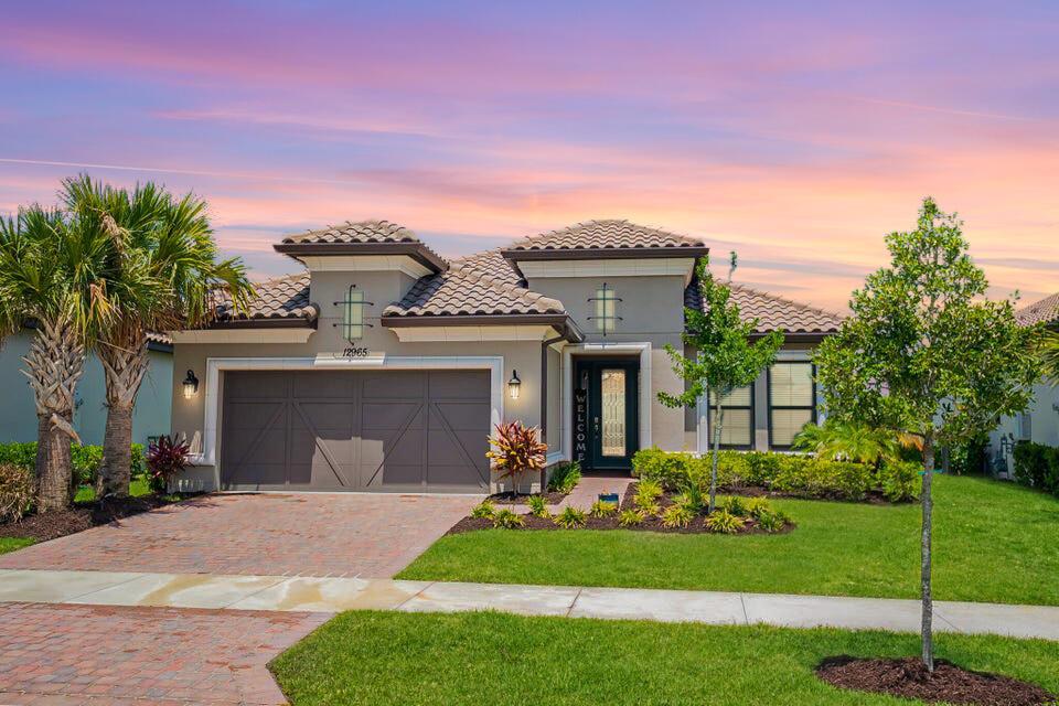 Esplanade, Tradition's premier 55+ community! This stunning unfurnished Lazio model offers 3 bedrooms + den, 3 baths, and a 4' extended 2-car garage, all overlooking a tranquil lake. The split floor plan provides ideal privacy, while the open design blends a spacious great room, dining area, and gourmet kitchen with gas cooking, walk-in pantry, stainless appliances, and large island. Retreat to the owner's suite with bay window, dual vanities, walk-in shower, and custom closet. Enjoy panoramic lake views from the screened lanai. Community clubhouse offers pool & spa, fitness center, tennis, pickleball, cafe, pet park & more. Lawn care, cable & internet included with rent! Property is available for October 1, 2025 move in or later.