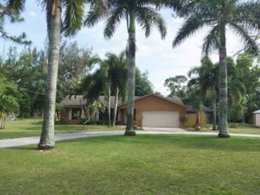 Hurricane Impact windows! Lots of upgrades in this pampered home featuring beautiful custom marble floors with delicate inlays. Spacious layout with very large (approx 24 x 24) family room, pass thru bar to kitchen with Granite counter tops and tumbled marble back splash, wood cabinets and a large island work center. All SS appliances included. Split bedroom plan, crown molding, knock down ceilings and creative lighted niches. Custom glass and marble master shower. French doors lead to the screened patio with heated pool and spa. So many extras! 
http://tour.circlepix.com/home2/UF7GQJ