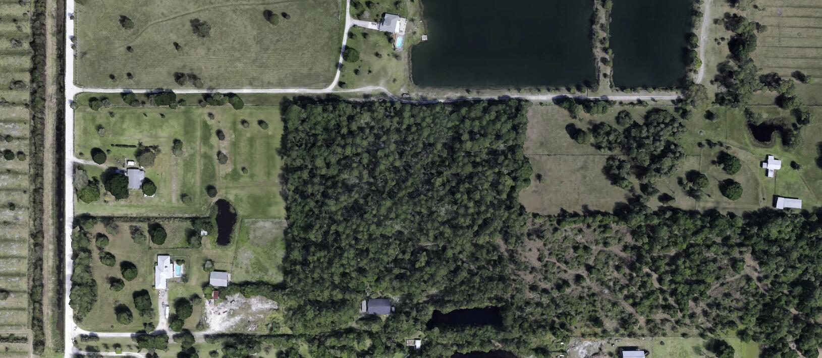 Country Living situated close to the pristine Fort Pierce Beaches and highly desirable Downtown! Abundant growth nearby with proposed World class Surf Park! Build a Private and Secluded Ranch Estate home on this 10.29 Acres. 1/2 mile from Orange Ave and just a few miles to I-95/Turnpike Exits. The existing structure is a Bonus: 2,480 sf CBS Building once used as a Bee barn which can be converted per county to a beautiful home. An existing bldg. offers potential for simpler land financing with a rennovation/construction loan. Building sold 'AS is' Well/septic/electric on site. 10 ft walls on 4 ft elevation. Bldg needs improvements. Buyer must verify utilities! 240x74 ft pond is in SE corner. Long driveway, mature oaks, pines adds extra seclusion. Imagine your dream Estate home here!!