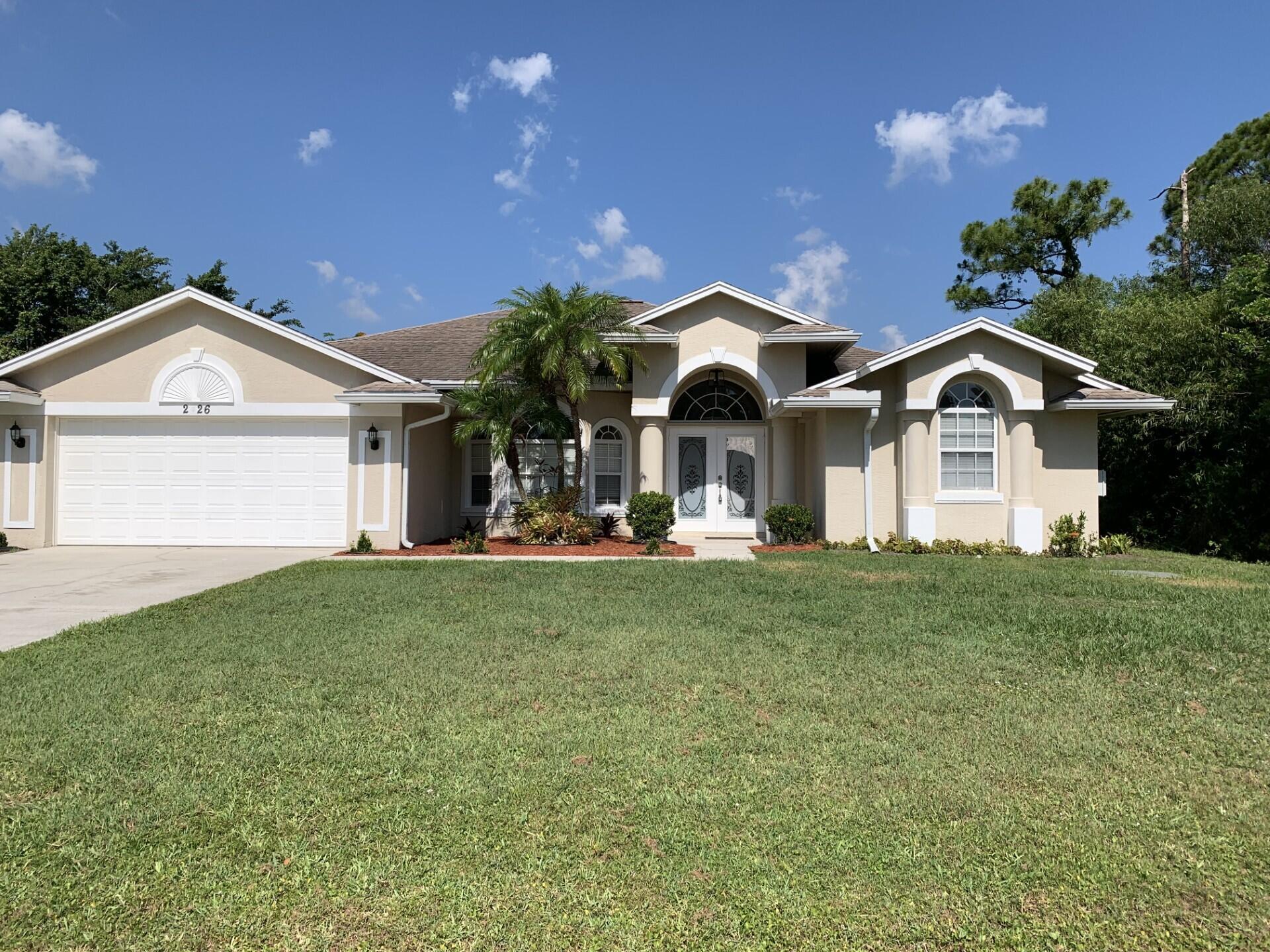 Spacious 3/2/2 with large, screened lanai. The home features tile and vinyl flooring throughout, separate living room, family room, and formal dining room, vaulted ceilings, and fresh paint. Rent includes lawncare. The home is located in a desirable location close to schools, shopping, I95, turnpike, hospitals, and local beaches.