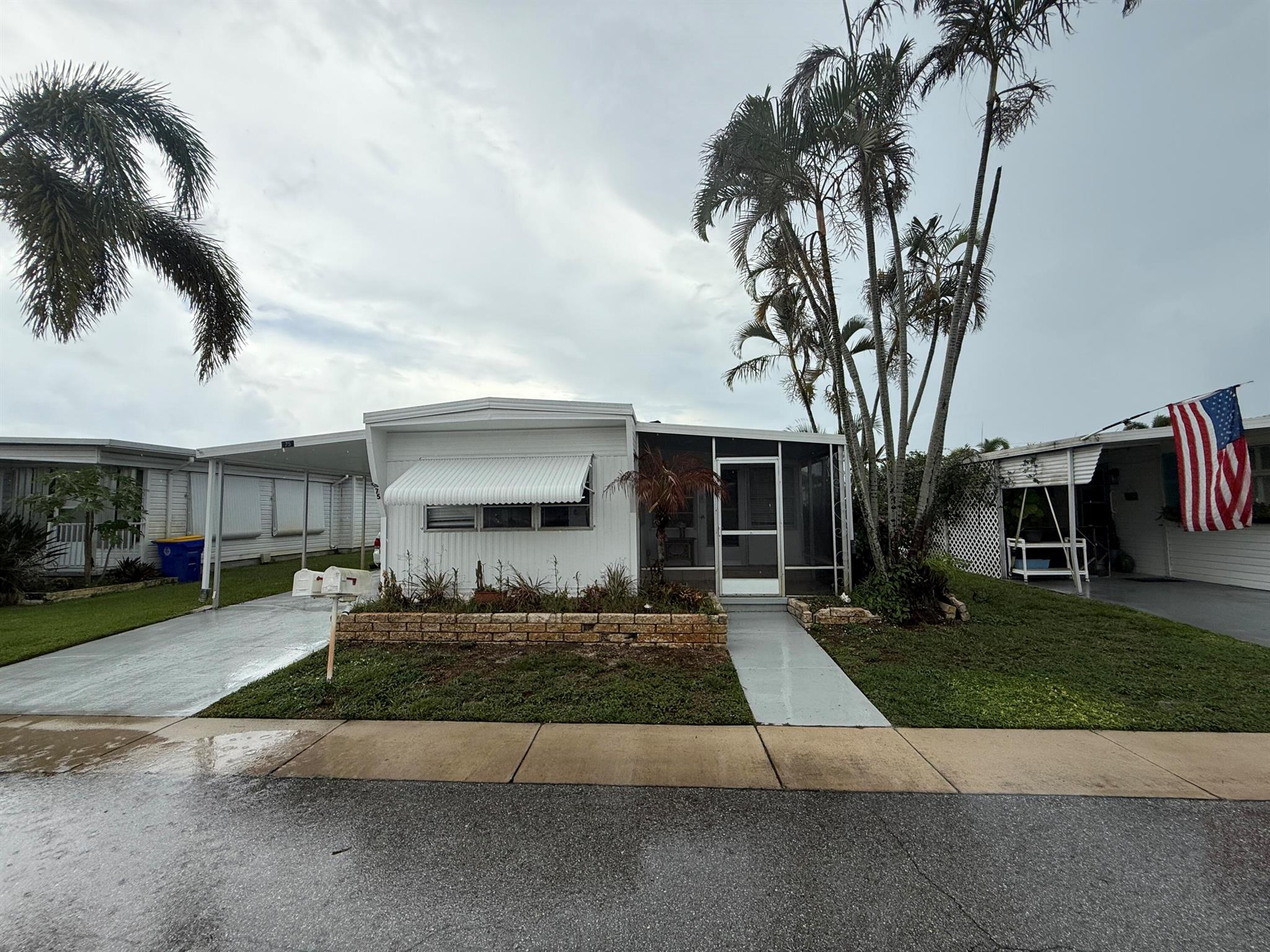 Remodeled 2 Bedrm/2 Bath 1969 Manuf home in Hidden Harbour 55+ yachting community.. The flooring was replaced w 100% Vinyl Plank flooring thruout. The Kitchen cabinets were restored & painted w new hardware, new butcher block counter, tile backsplash & white appliances. New Kitchen sink, faucet & related plumbing. New GFCI receptacles in Kitchen & both Baths. The Kitchen is open to the Dining Area & light filled LR. The Primary Bedrm is in the rear of the home w built-in closets and redone Primary Bath on the Hall. The 2nd Bedrm is off the LR w it's own full bath. Both Bathrooms have new Vanities & chair height toilets. A newly finished bonus room under the carport w window a/c could serve as office, tackle room etc w laundry room next door. New 3.5 Ton HEAT PUMP 2025. $350/mo COA fee.