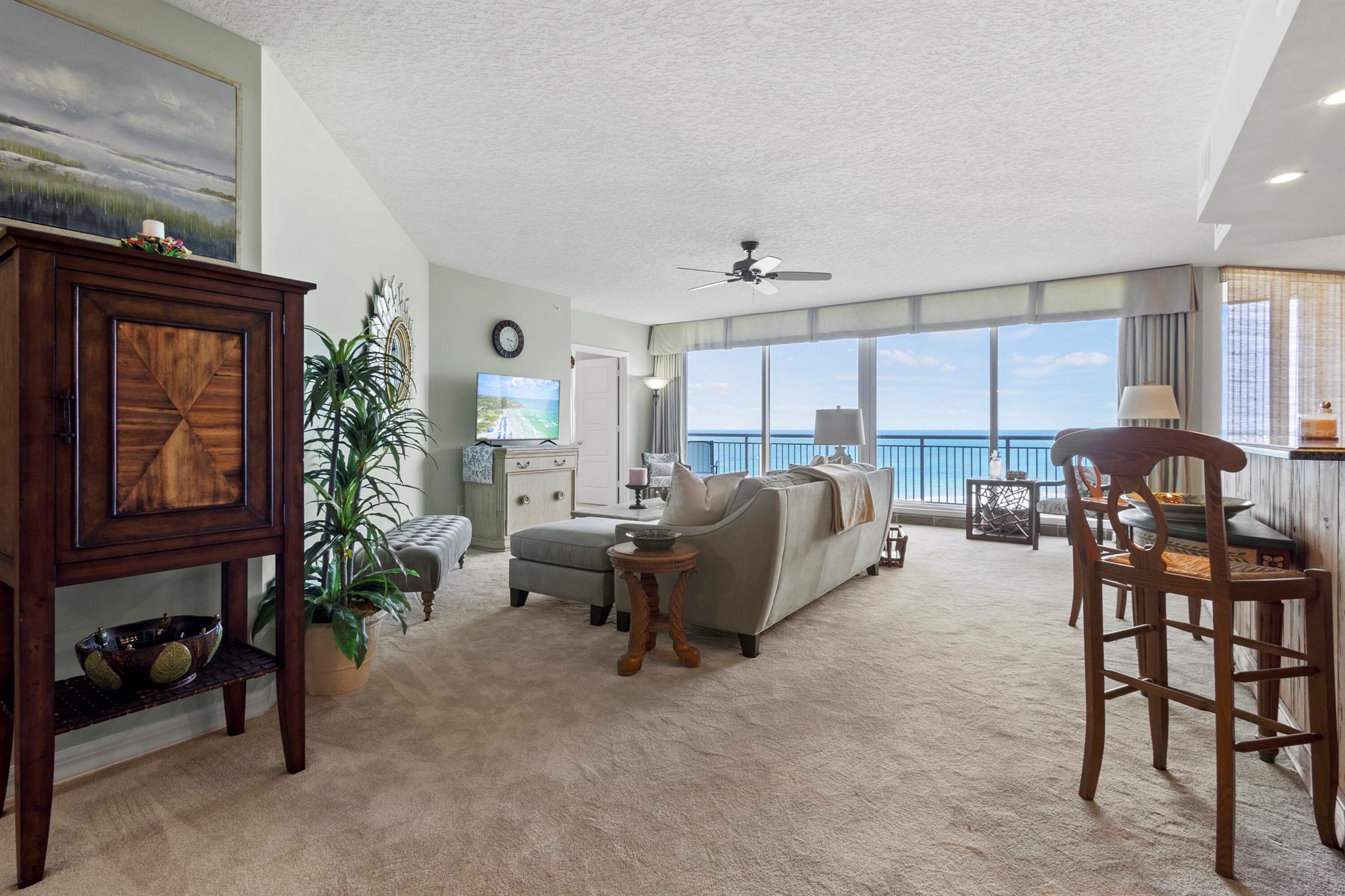 Available for 90 Days Minimum! This elegantly appointed 3-bedroom, 2.5-bath oceanfront condo with private garage is located in the highly sought-after Atrium II on North Hutchinson Island, offering panoramic views of the Atlantic Ocean and Fort Pierce Inlet. A grand rotunda foyer with coffered ceilings and marble tile leads into a spacious split-bedroom layout, featuring custom finishes and floor-to-ceiling windows that flood the space with natural light.The gourmet kitchen boasts Sub-Zero and Bosch appliances, a wine cooler, honed granite countertops, and a breakfast bar finished in reclaimed pecky cypress. Solid core wood doors, custom cabinetry, and built-ins enhance the upscale feel throughout.