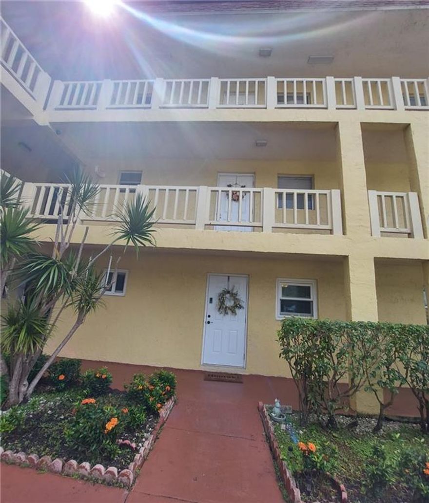 Look no further! Immaculate unit at Natura! Just minutes from the beach with shopping centers all around! Gorgeous corner unit with impact glass wall on enclosed patio which has become a beautiful Florida room! Brand new A/C and updated electrical panel.  Porcelain tile floors in kitchen and bathroom and waterproof vinyl in living areas. Breakfast bar and kitchen with stainless steel appliances. 6' baseboard thru out except for master bedroom. No popcorn ceilings!!!!  Remodeled bathroom! Customized storage with lots of closet space and all pantries with new shelves. All new ceiling fans and custom made shades.