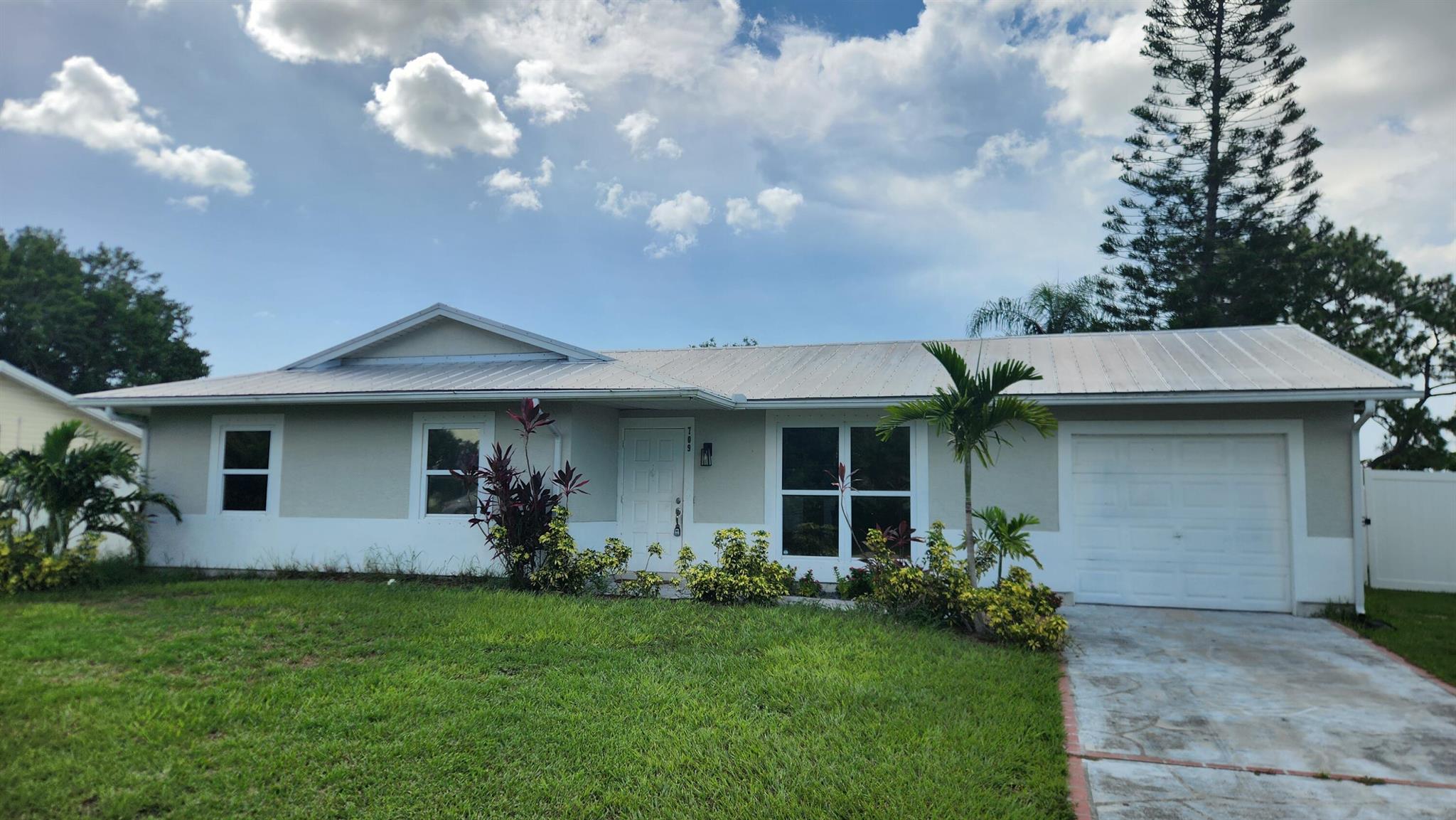 Welcome to this beautifully maintained home offering spacious living with modern updates. Enjoy the bright open floor plan, wood floors, and a stunning kitchen with appliances and Corian countertops. Featuring a newer metal roof and exterior siding, both installed in 2020, plus a screened lanai for relaxing. Also, it boasts a newer Air Conditioner and Water Heater having been installed only 2 yrs ago. The primary suite includes a private bath and ample closet space. Each bedroom also has newer ceiling fans. The fenced backyard is ideal for kids, pets, or entertaining. Conveniently located near schools, parks, shopping, and highways for easy commuting. Perfect for first-time buyers, investors, or families. Don't miss this wonderful opportunity to invest or make it your new home!