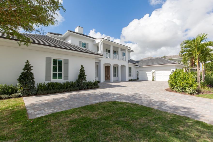 Stunning new construction currently underway in the exclusive Blue Cypress section of Palm Beach Polo and Country Club. This two-story estate home has five bedrooms, five full and two half bathrooms, with a split floor plan. The master suite is conveniently located on the first floor and enjoys easy access to the back patio. Wood floors and soaring ceilings are found throughout the home. Two attached garages house three cars. The grounds to include a beautiful pool area and outdoor entertaining space, lush tropical landscaping, and remarkable golf course views.