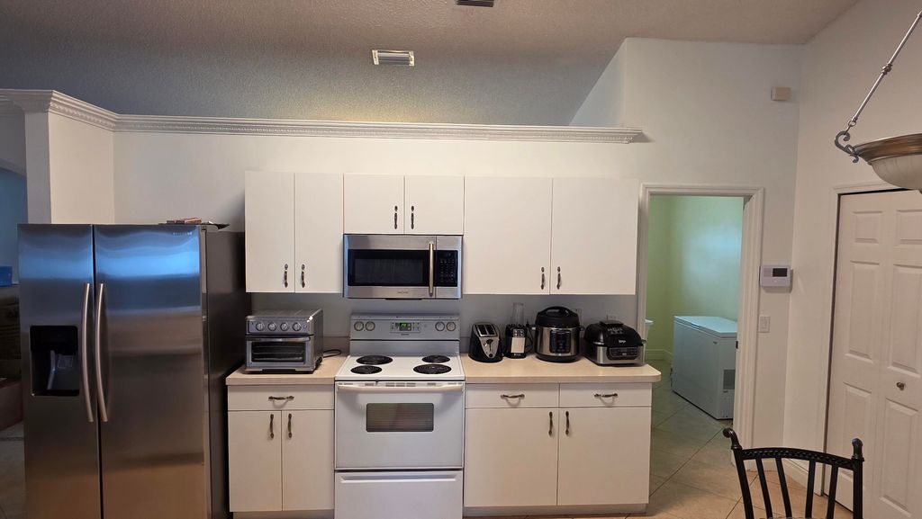 Photo of 6448 NW Colgate Street, Port Saint Lucie, FL 34986 (MLS # B26004018)