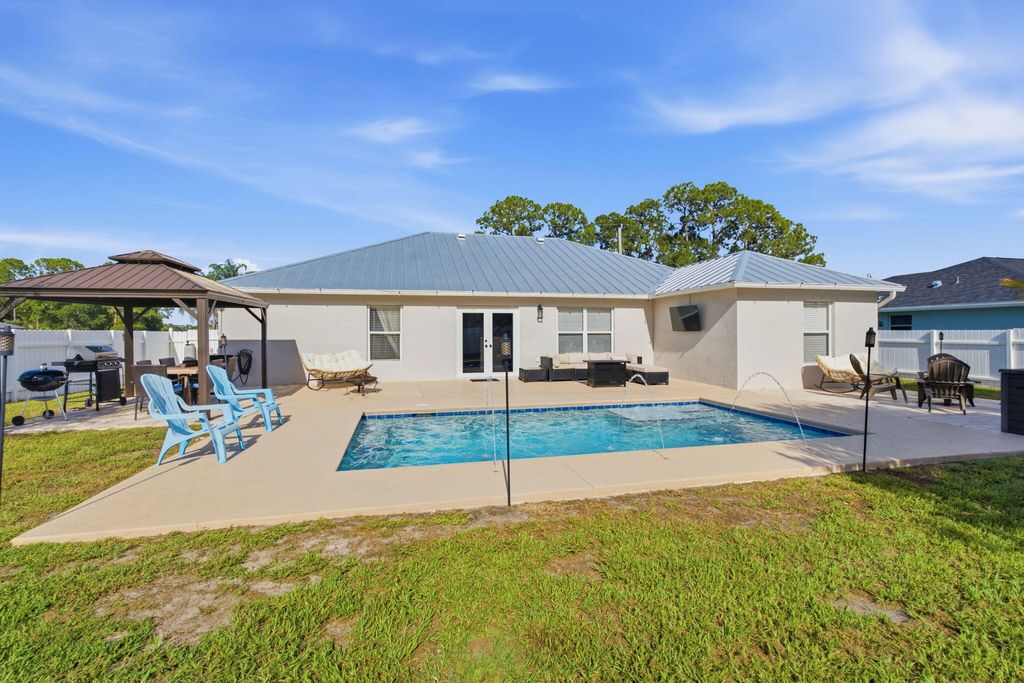 Photo of 4156 SW Belshaw Street, Port Saint Lucie, FL 34953 (MLS # B26046212)