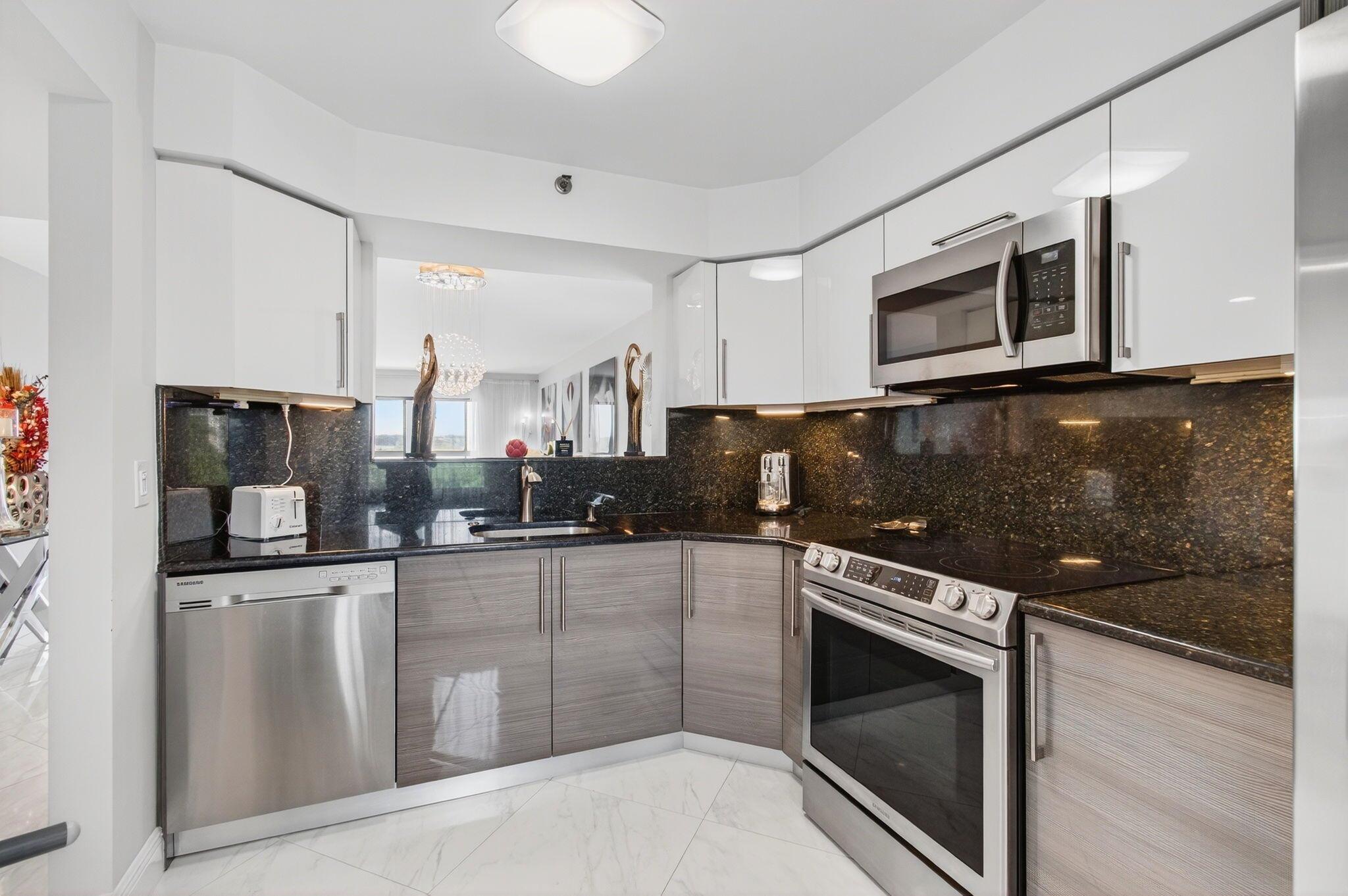 HUNTINGTON LAKES--ACTIVE ADULT COMMUNITY, 55+ community.Welcome to the vibrant Community of Huntington Lakes, where comfort meets modern luxury. Situated at 7260 Kinghurst Drive, unit 401, section 5, pride of place is given to a meticulously renovated corner unit. This residence comfortably sits on the fourth floor, offering its inhabitants remarkable views of a serene lake from both the front and rear of the unit.The key highlight of this unit is undoubtedly the comprehensive renovation, which has elevated every aspect of this living space. Sleek porcelain floors now extend seamlessly across the entire unit, with no popcorn ceiling, while contemporary impact windows assure a sense of tranquility and aesthetic appeal.