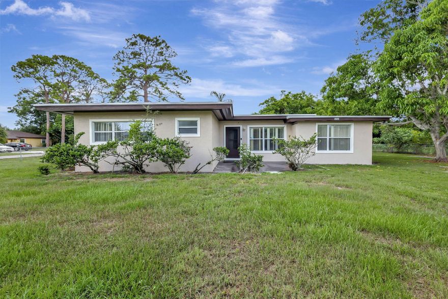 THIS HOME IS TOTALLY RENOVATED WITH NEW APPLIANCES, NEW FLOORS, BATHROOMS REDONE. NEW LIGHTING FIXTURES, NEW FANS, NEW AC, FRESHLY PAINTED INSIDE AND OUTSIDE. A MUST SEE! HOME SITS ON A DOUBLE LOT CONNER PROPERTY.  3 bedrooms, 2 full baths, huge additional room and oversized laundry room.