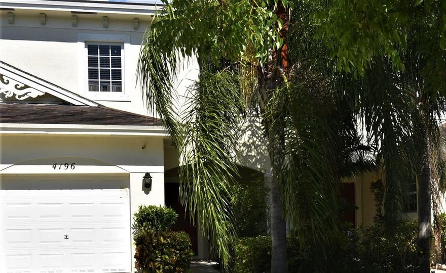 Come see this desirable lakefront townhouse within the gated Emerald Lake Townhomes community in Lake Worth. Enjoy the tranquil waters, mesmerizing sunsets, and nature as you sit in your screened-in-porch. This spacious home has been maintained in a superior fashion and is move-in ready. The home features an open floor plan and spacious bedrooms upstairs while offering plenty of natural light. The community includes a common pool, bike path and a beautiful nature preserve.  This home is minutes away from Palm Beach State College, JFK Hospital, John Prince Park, the beach, shopping, dining and the Arts District in downtown Lake Worth. Don't miss the opportunity to own this beautiful home. Schedule a showing today!