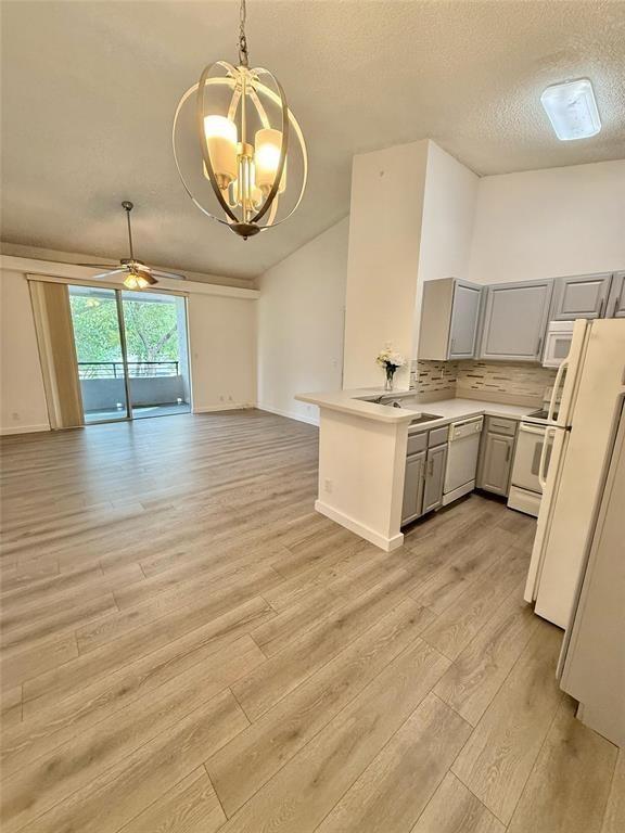 Fabulous Corner Unit – Bright, Spacious, and Move-In Ready! Welcome to your new home! This stunning corner unit offers exceptional privacy with no neighbors on any side, located on the second floor and bathed in natural light throughout the day. Enjoy a serene view, a large private balcony with a storage room, and an inviting, open-concept living space. Step inside to find new laminate flooring, soaring vaulted ceilings, and a bright, airy layout that makes every room feel warm and welcoming. The spacious living room flows effortlessly into the open kitchen, perfect for entertaining or everyday living. Any tenant would love it!!!