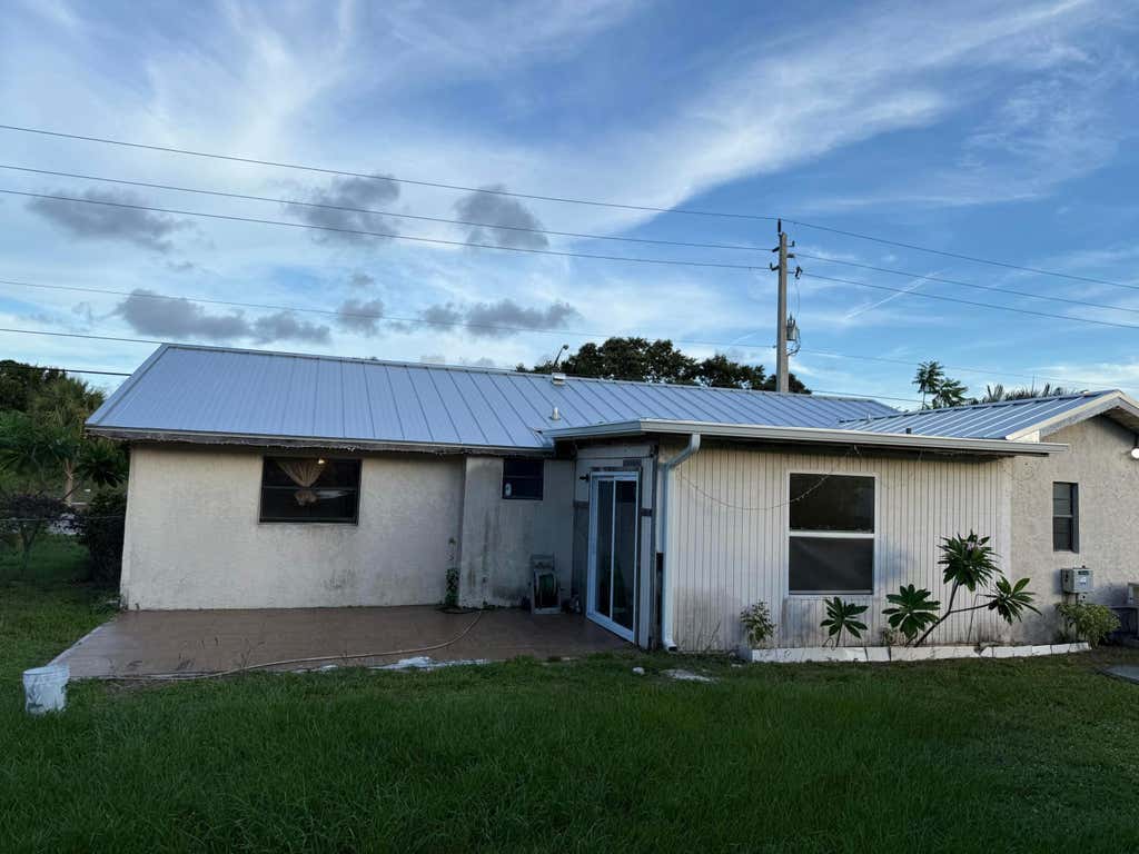 Photo of 611 SW Port St Lucie Boulevard S, Port Saint Lucie, FL 34953 (MLS # R11063783)