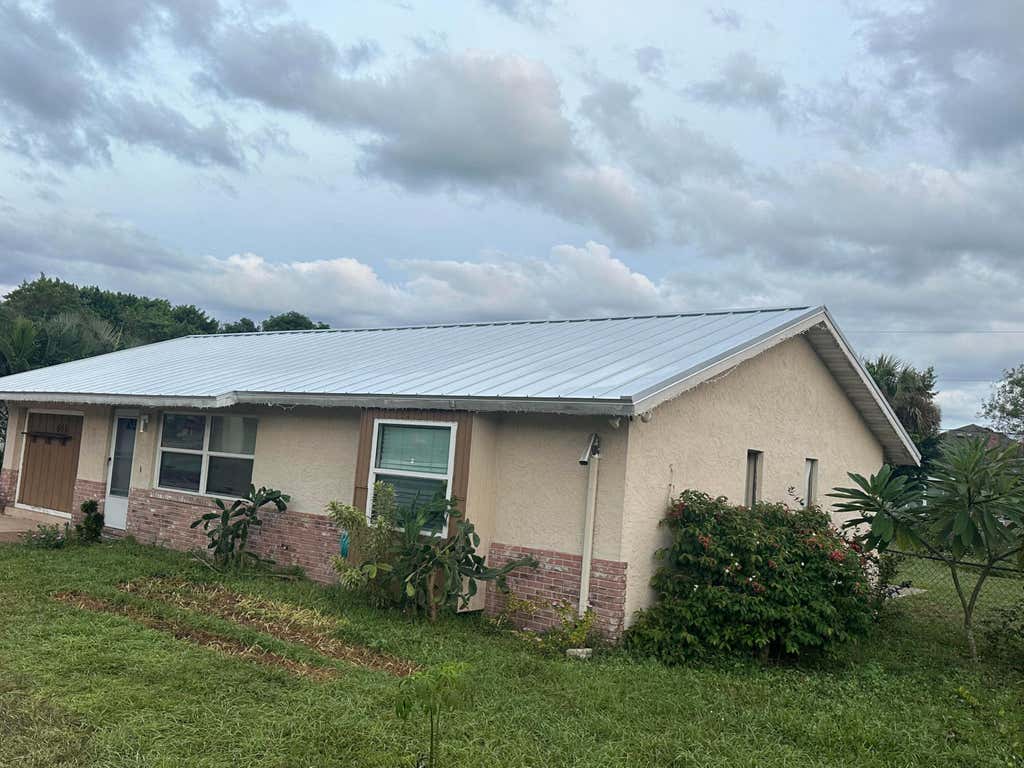 Photo of 611 SW Port St Lucie Boulevard S, Port Saint Lucie, FL 34953 (MLS # R11063783)